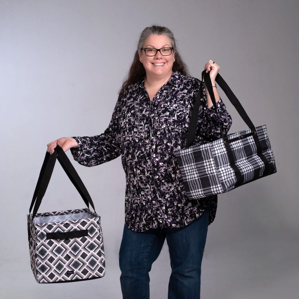 Lisa Herttua holding Thirty-One Gifts Totes