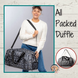 Traveler holding All Packed Duffle bag.
